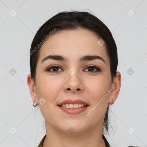 Joyful white young-adult female with short  brown hair and brown eyes