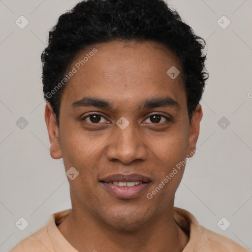 Joyful black young-adult male with short  black hair and brown eyes