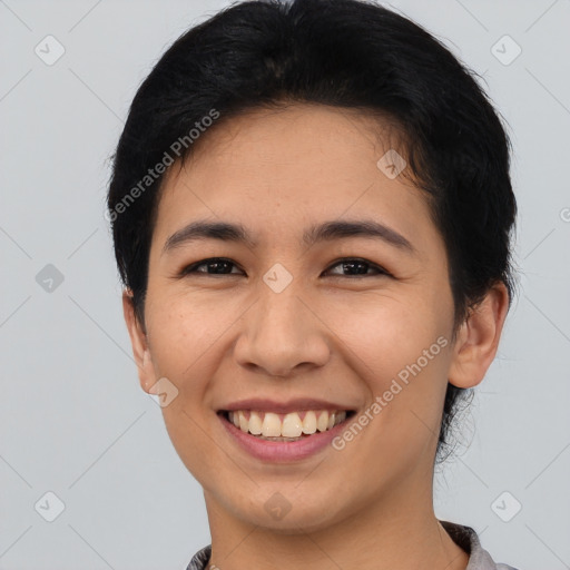 Joyful asian young-adult female with short  black hair and brown eyes