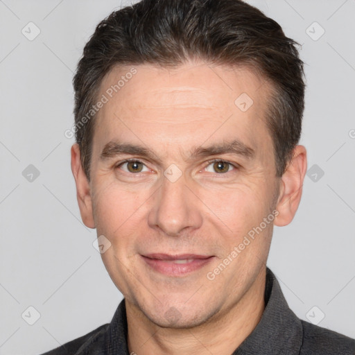 Joyful white adult male with short  brown hair and brown eyes