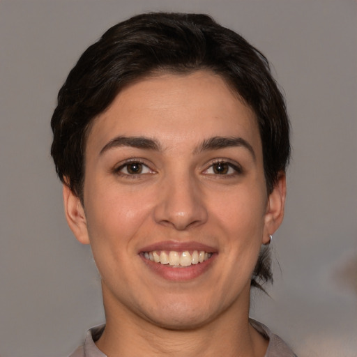 Joyful white young-adult female with short  brown hair and brown eyes