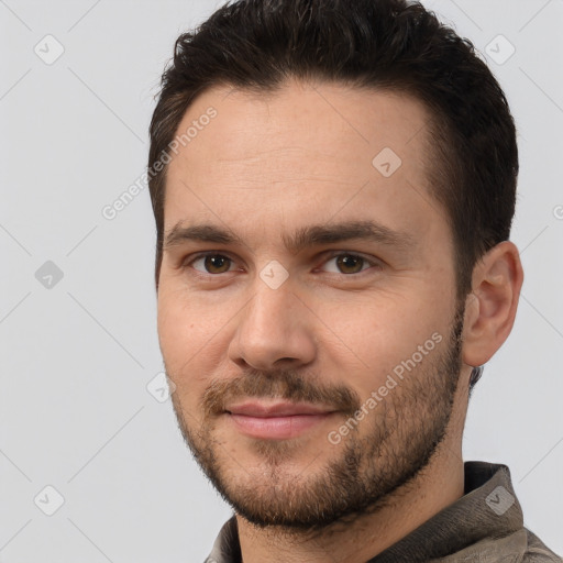 Joyful white young-adult male with short  brown hair and brown eyes