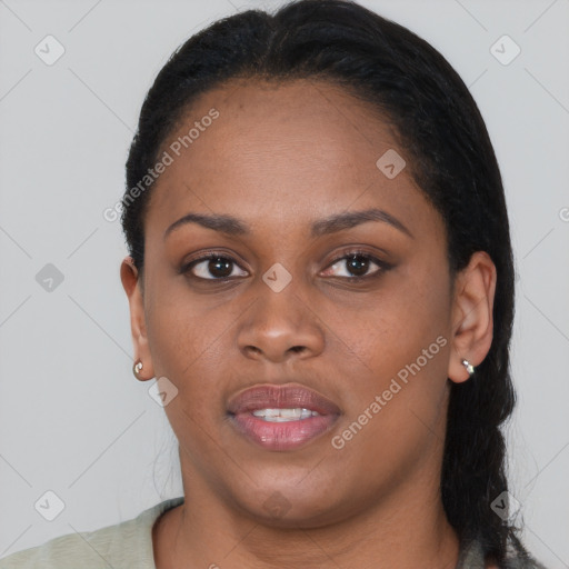 Joyful black young-adult female with short  black hair and brown eyes