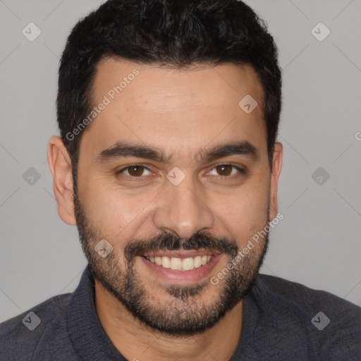 Joyful white young-adult male with short  black hair and brown eyes