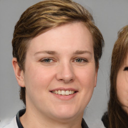 Joyful white young-adult female with medium  brown hair and blue eyes