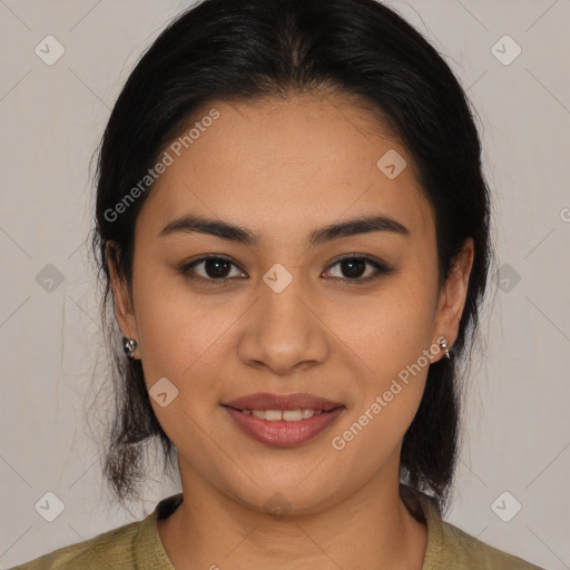 Joyful latino young-adult female with medium  brown hair and brown eyes