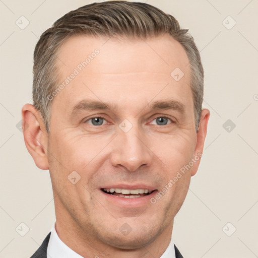 Joyful white adult male with short  brown hair and grey eyes