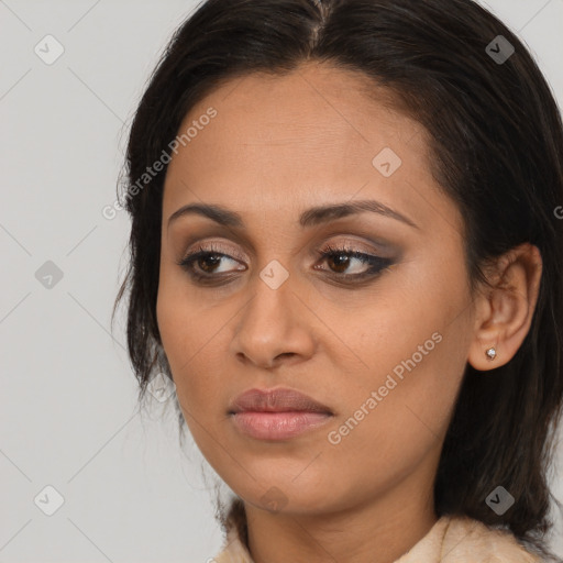 Joyful latino young-adult female with long  brown hair and brown eyes