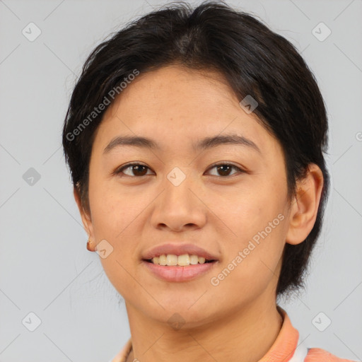 Joyful asian young-adult female with short  brown hair and brown eyes