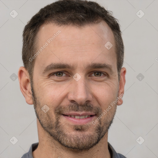 Joyful white adult male with short  brown hair and brown eyes