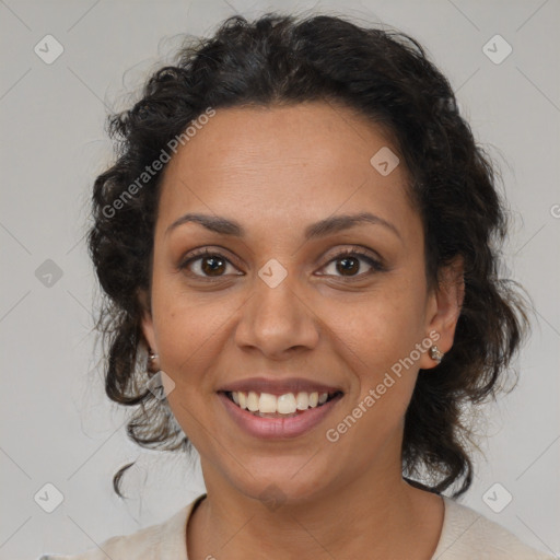 Joyful latino adult female with medium  brown hair and brown eyes