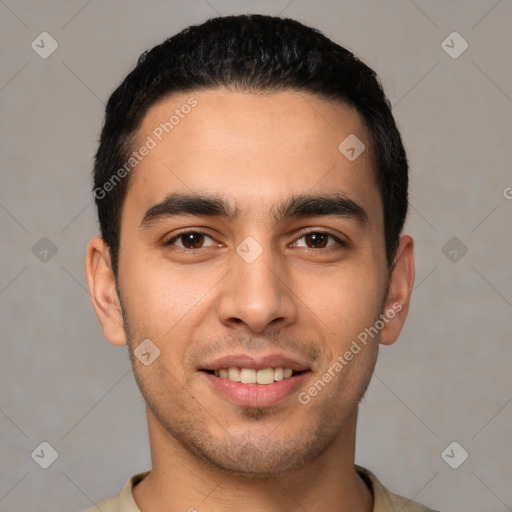 Joyful white young-adult male with short  black hair and brown eyes