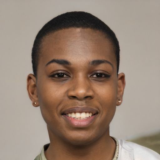 Joyful black young-adult female with short  black hair and brown eyes