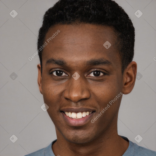 Joyful black young-adult male with short  black hair and brown eyes