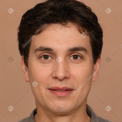 Joyful white adult male with short  brown hair and brown eyes