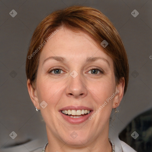 Joyful white adult female with short  brown hair and grey eyes