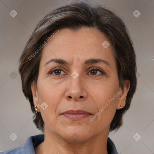 Joyful white adult female with medium  brown hair and brown eyes