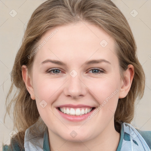 Joyful white young-adult female with medium  brown hair and blue eyes