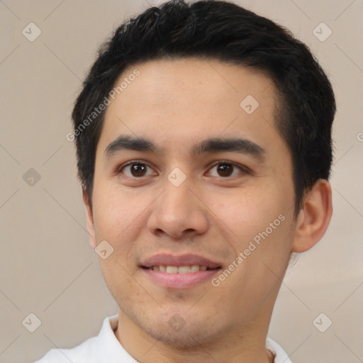 Joyful white young-adult male with short  black hair and brown eyes