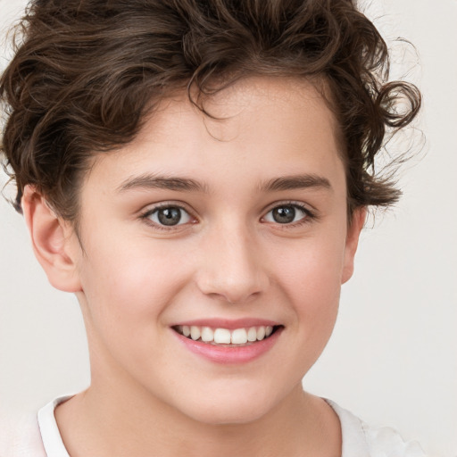 Joyful white child female with short  brown hair and brown eyes