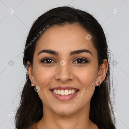 Joyful latino young-adult female with long  brown hair and brown eyes