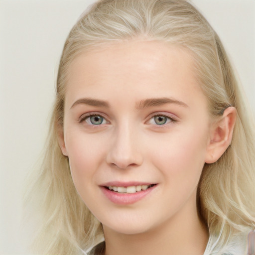 Joyful white young-adult female with long  brown hair and blue eyes