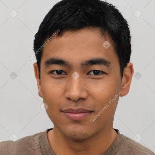 Joyful asian young-adult male with short  black hair and brown eyes