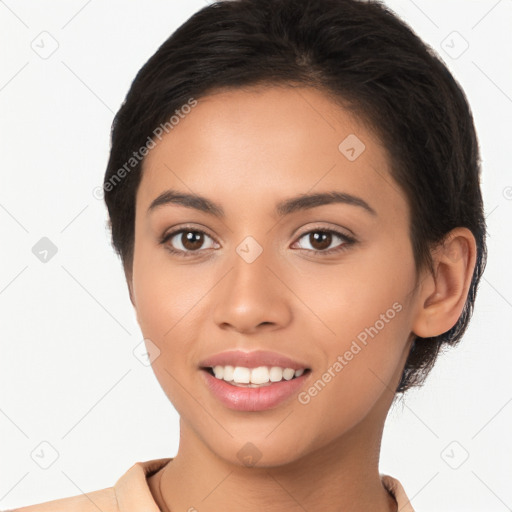 Joyful latino young-adult female with long  brown hair and brown eyes