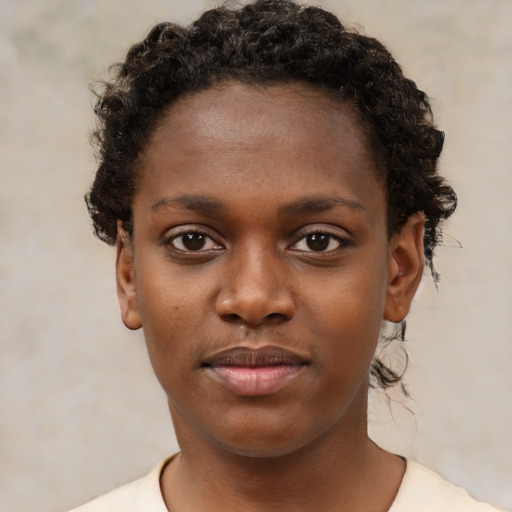 Neutral black young-adult female with short  brown hair and brown eyes