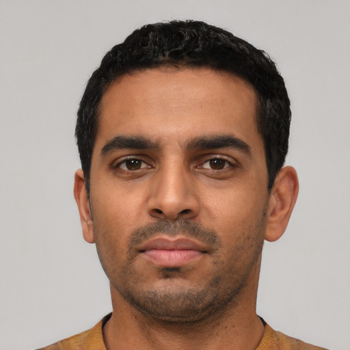 Neutral latino young-adult male with short  black hair and brown eyes