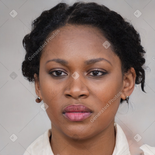 Neutral black young-adult female with medium  brown hair and brown eyes