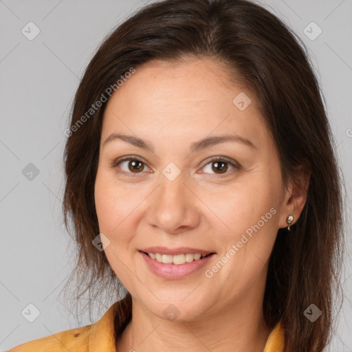 Joyful white adult female with medium  brown hair and brown eyes