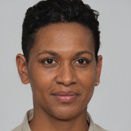 Joyful black young-adult female with short  black hair and brown eyes