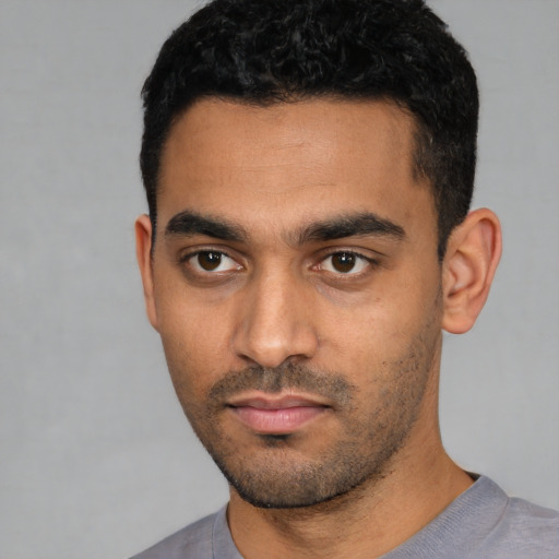 Neutral latino young-adult male with short  black hair and brown eyes