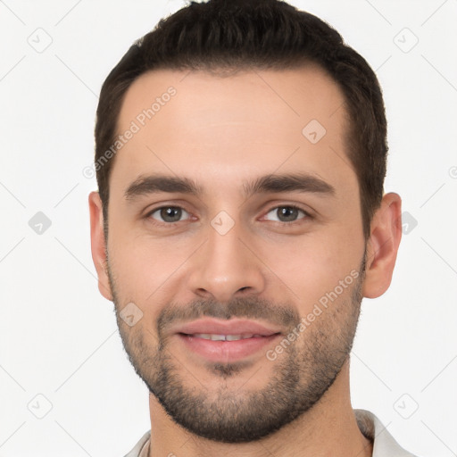 Joyful white young-adult male with short  black hair and brown eyes