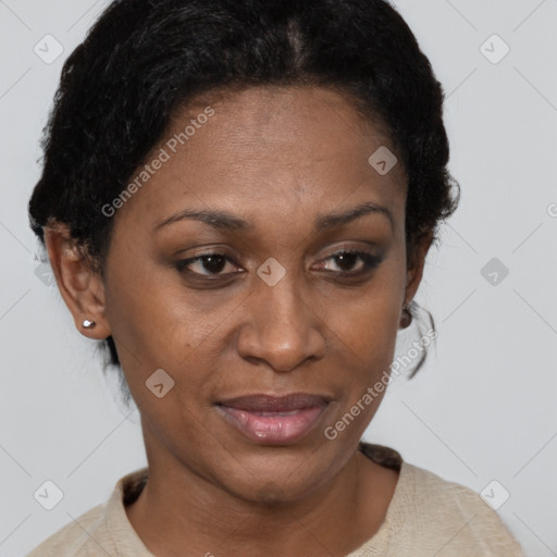 Joyful black adult female with short  brown hair and brown eyes