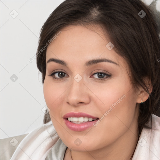 Joyful white young-adult female with medium  brown hair and brown eyes