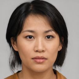 Neutral asian young-adult female with medium  brown hair and brown eyes