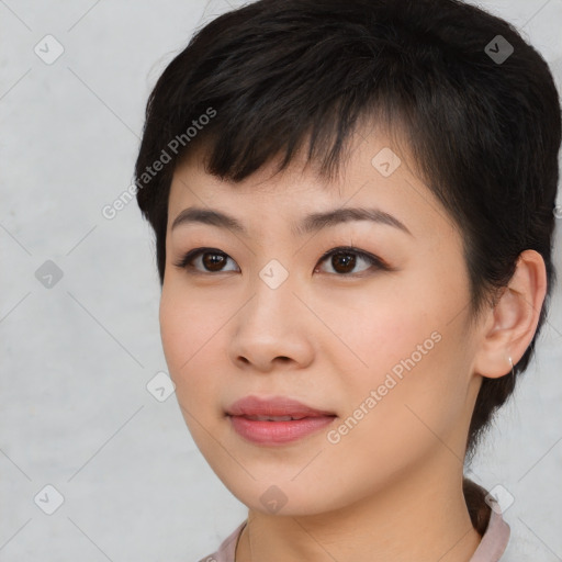 Joyful asian young-adult female with short  brown hair and brown eyes