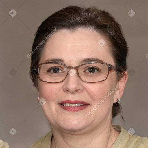 Joyful white adult female with medium  brown hair and blue eyes