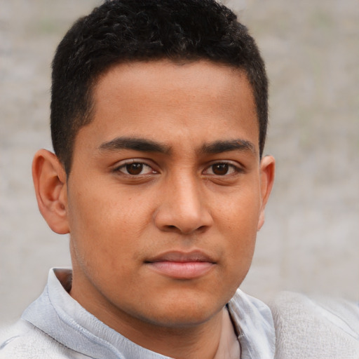 Neutral latino young-adult male with short  brown hair and brown eyes