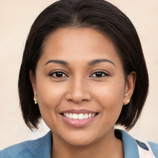 Joyful white young-adult female with medium  brown hair and brown eyes