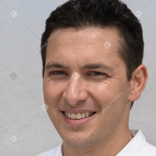 Joyful white adult male with short  brown hair and brown eyes