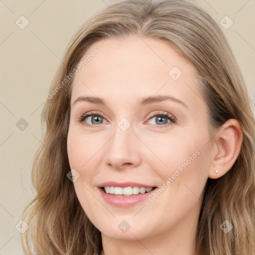 Joyful white young-adult female with long  brown hair and blue eyes