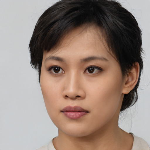 Neutral asian young-adult female with medium  brown hair and brown eyes