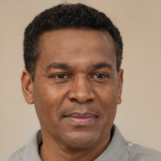Neutral latino adult male with short  brown hair and brown eyes