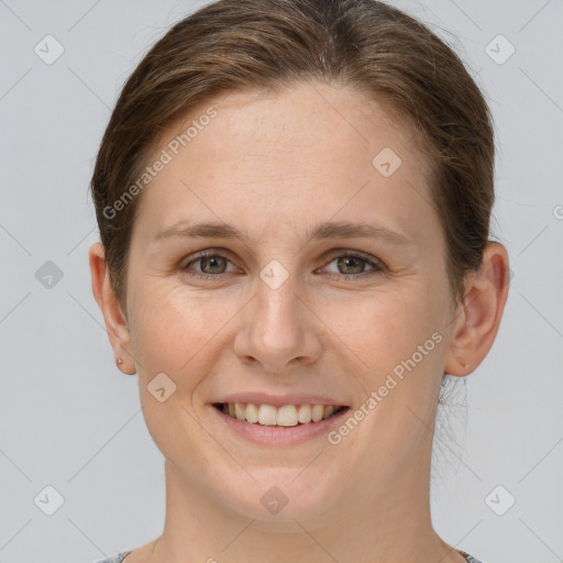 Joyful white young-adult female with short  brown hair and grey eyes