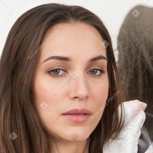 Neutral white young-adult female with long  brown hair and brown eyes