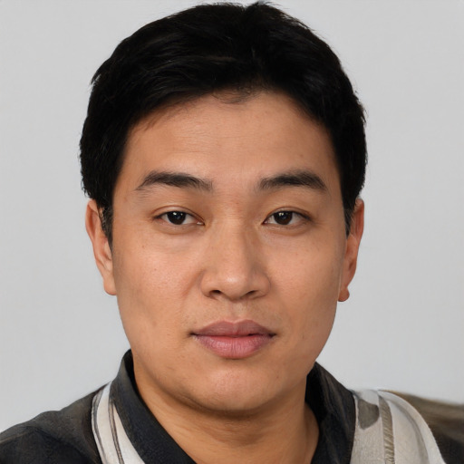 Neutral asian young-adult male with short  black hair and brown eyes