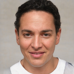 Joyful white adult male with short  brown hair and brown eyes